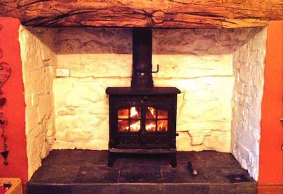 log burner installed into brick fire place