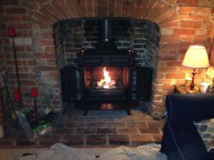 log burner installed into brick fire place