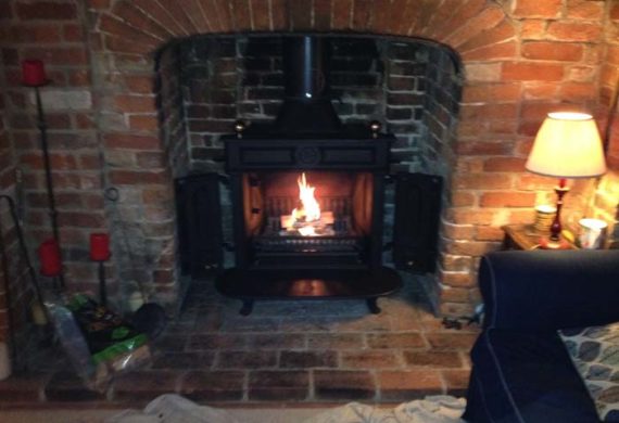 log burner installed into brick fire place