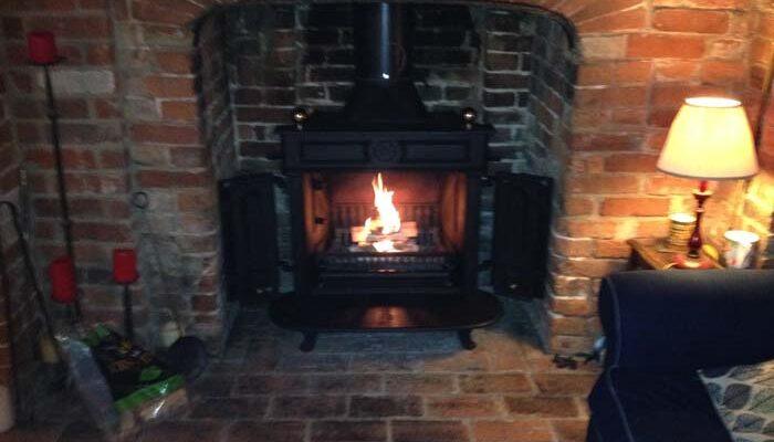 log burner installed into brick fire place