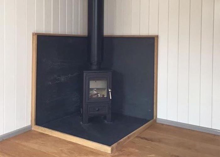 log burner in log cabin