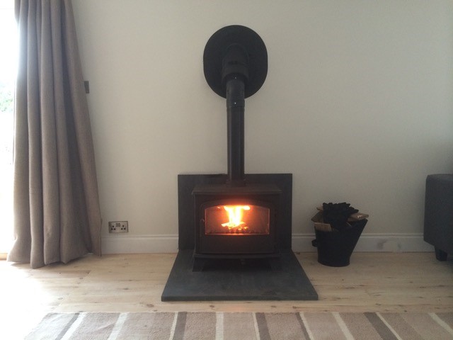 modern wood burner installed and lit