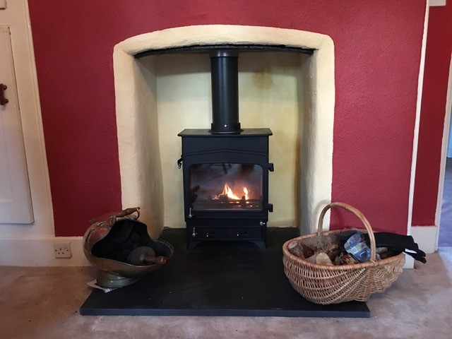 wood burning stove installed into traditional home